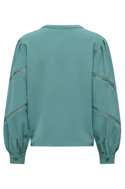 Blusa manga larga bordada